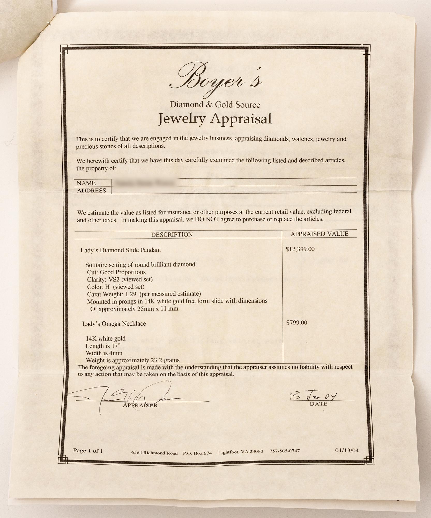 14K white gold solitaire diamond pendant.