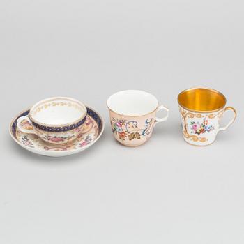 A Russian 19th century Popoff porcelain cup with saucer and two cups.