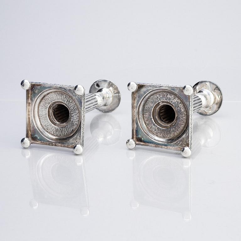 A pair of Gustavian silver candlesticks, unclear maker's mark, the cuffs with mark of Pehr Zethelius, Stockholm 1796.