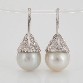 A pair of cultured South Sea pearl and diamond earrings.