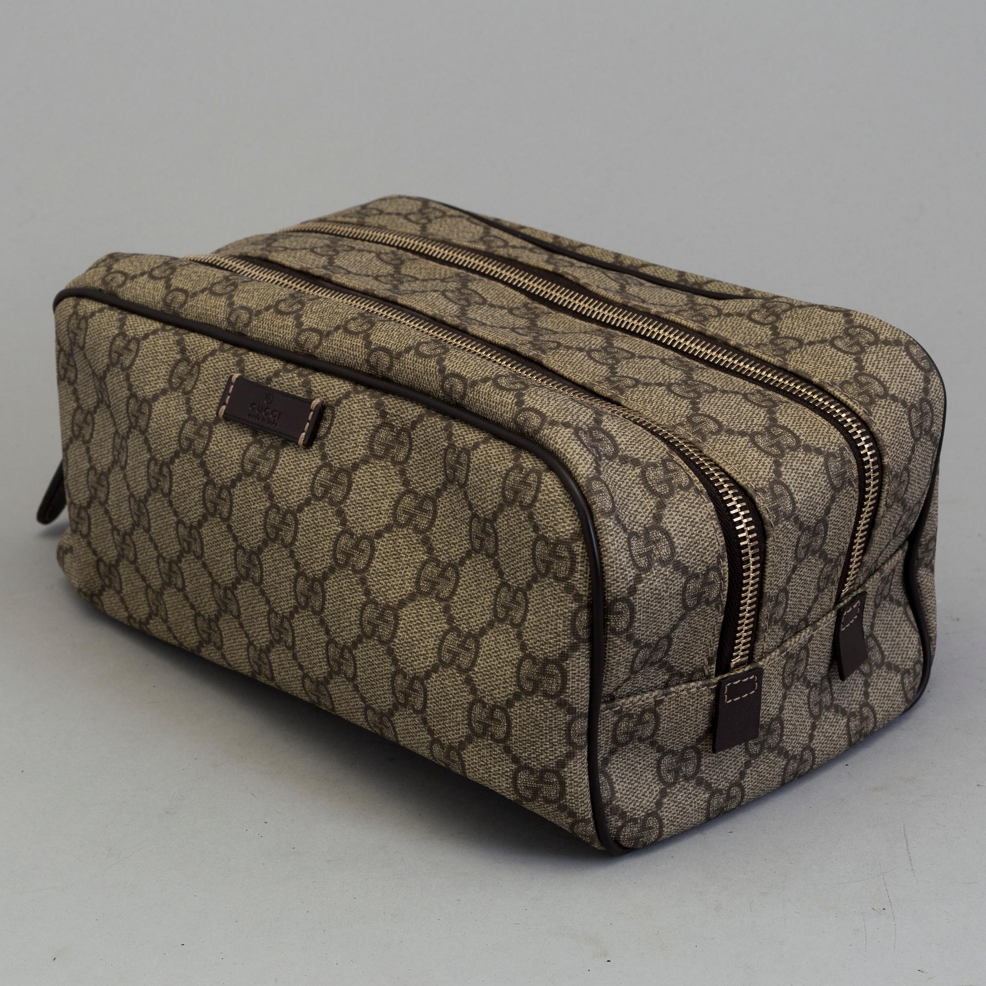 GUCCI, a monogram beauty bag.