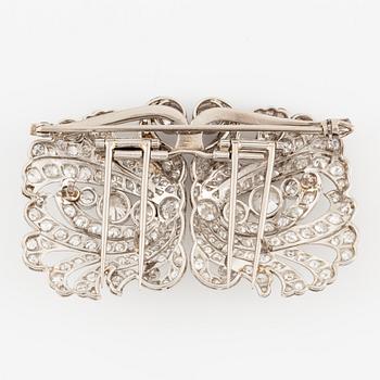 A brooch/double clip in platinum set with old- and eight cut diamonds.