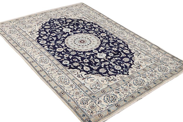A part silk Nain rug, 9LA, c. 292 x 190 cm.