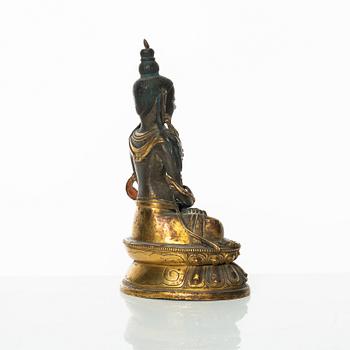 A gilt copper figure of Amitayus, Tibeto-Chinese, 18th Century.