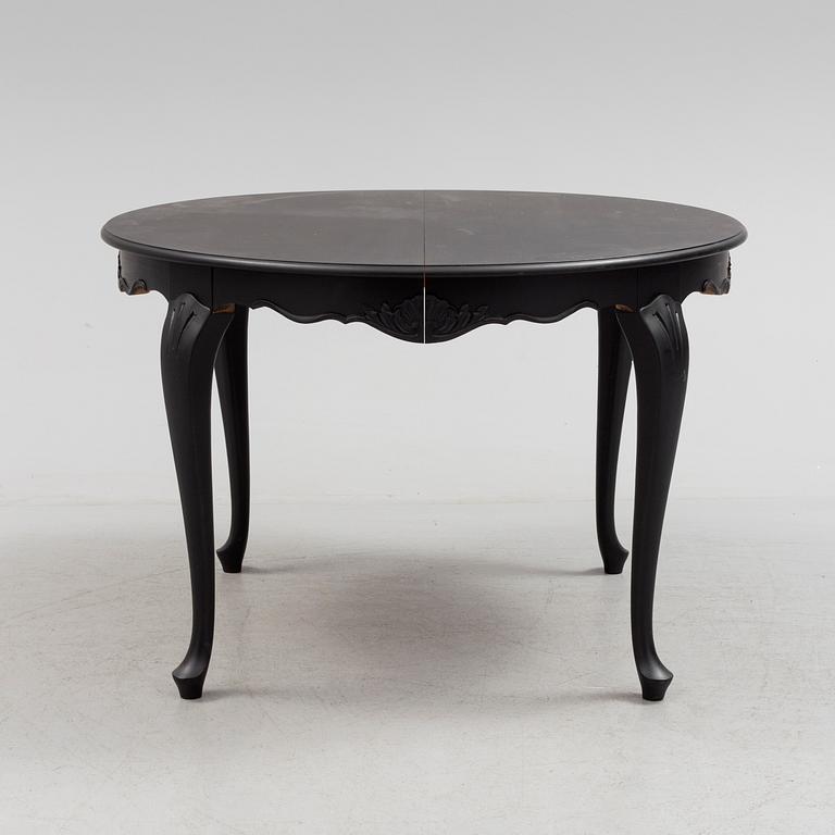 A mid 20th century rococo style dining table.
