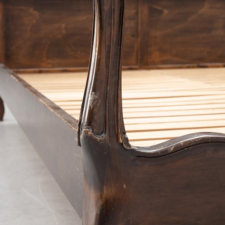 A rococo style bed frame, around 1900.