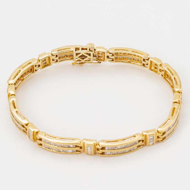 14K gold and small modified baguette cut diamond bracelet.