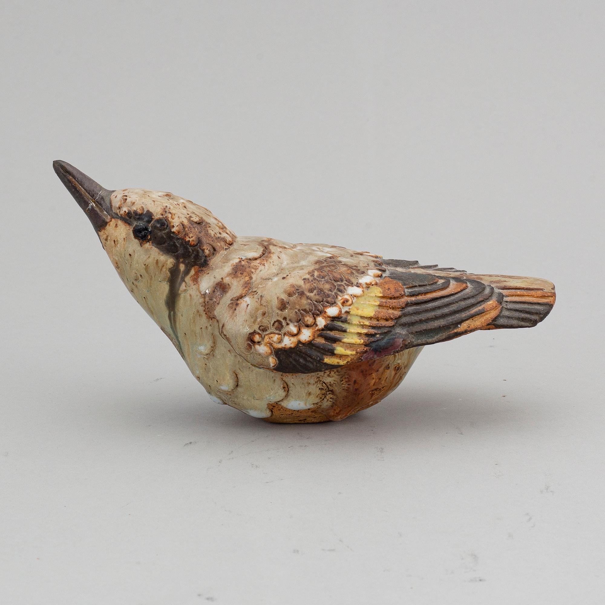 TYRA LUNDGREN, a stoneware sculpture of a bird, signed.