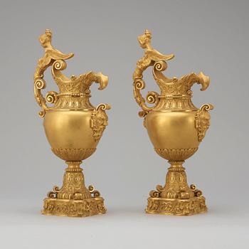 A pair of mid 19th century gilt bronze ornamental ewers.
