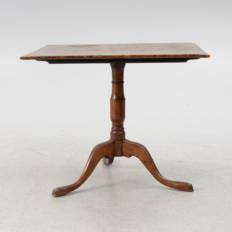 A drop-leaf table, circa 1800.
