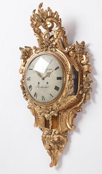 A rococo giltwood cartel clock by J. Lindgren (master in Stockholm 1761-62).
