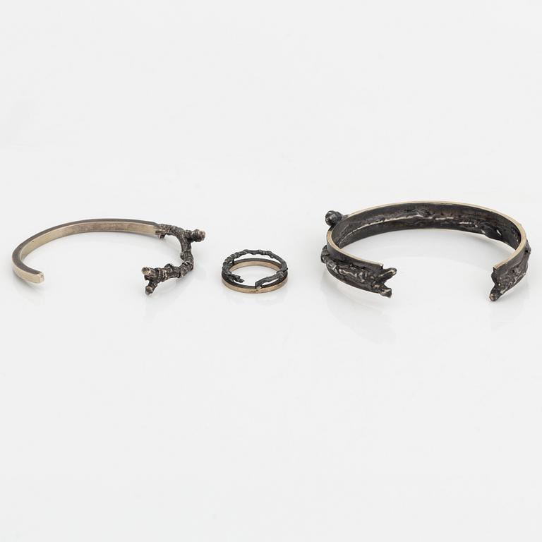 Two Copula silver bracelets and a ring.