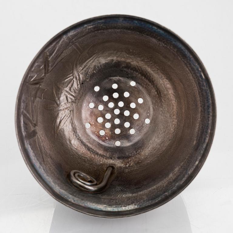 A silver cocktail shaker with strainer, Japan, first half of the 20th century.