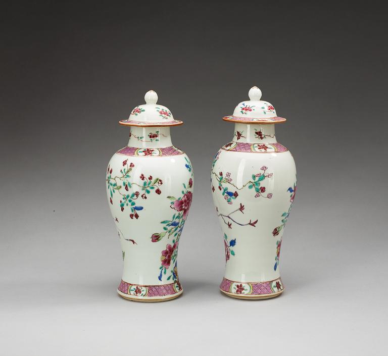 A pair of famille rose vases with covers, Qing dynasty (1736-95).