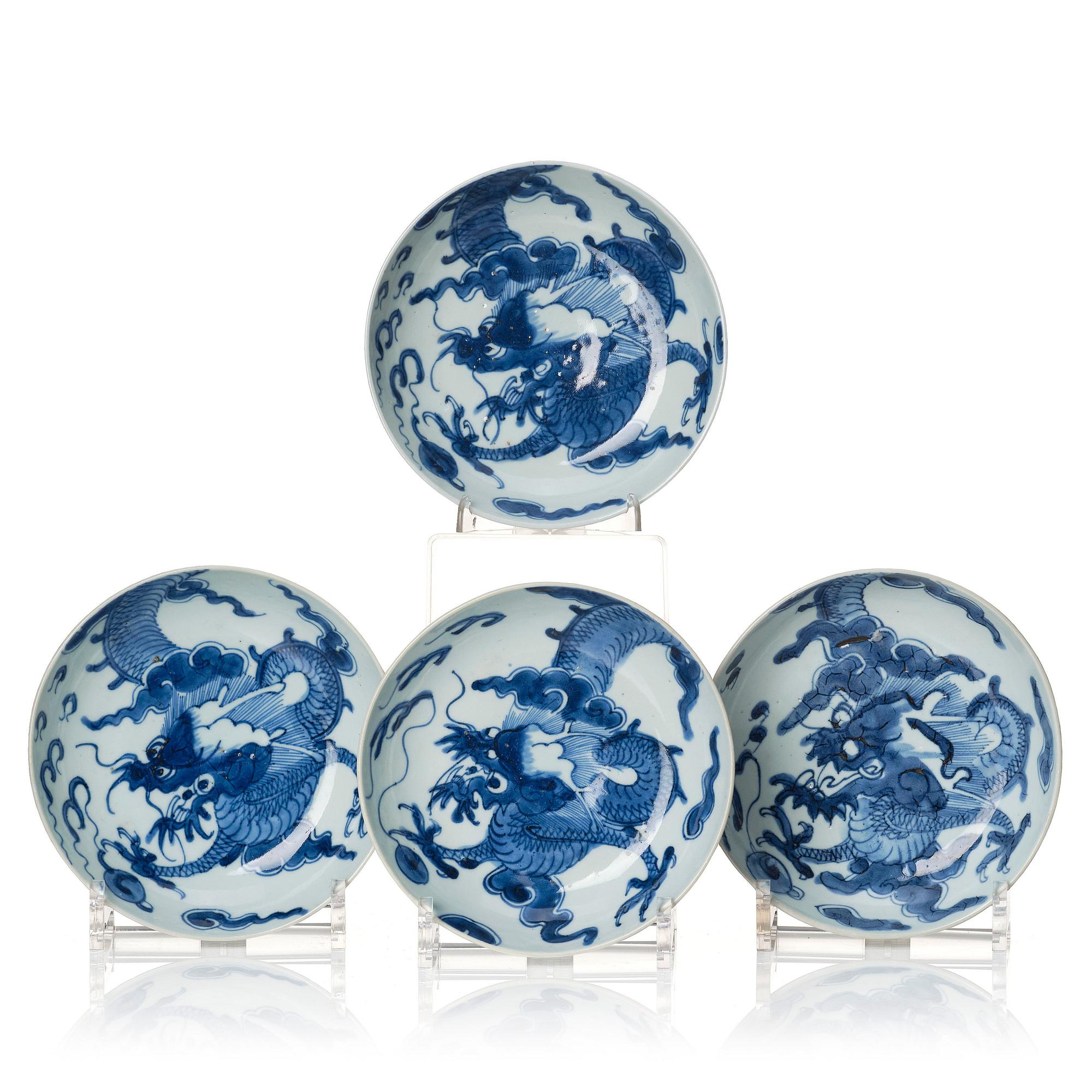 A set of four blue and white dragon dishes, Qing dynasty, 18th Century.