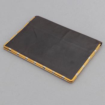 Cartier, troligen. Plånbok.