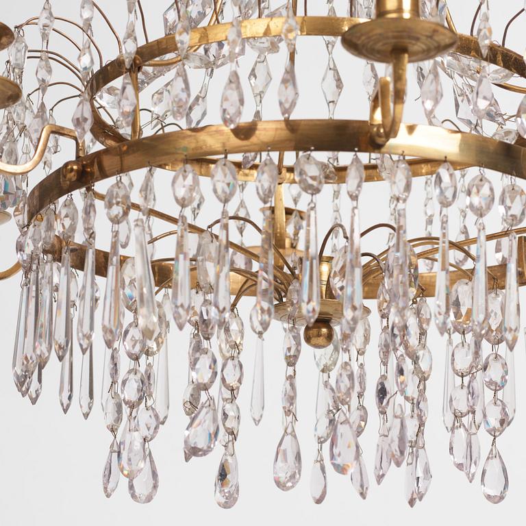 A late Gustavian gilt brass and cut glass seven-branch chandelier, Stockholm, late 18th century.