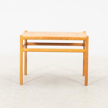 An oak side table by Johannes Andersen Denmark middle of the 20th century.