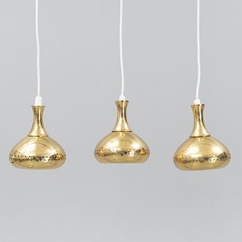 A set of three brass pendule lights, second half of the 20th Century.