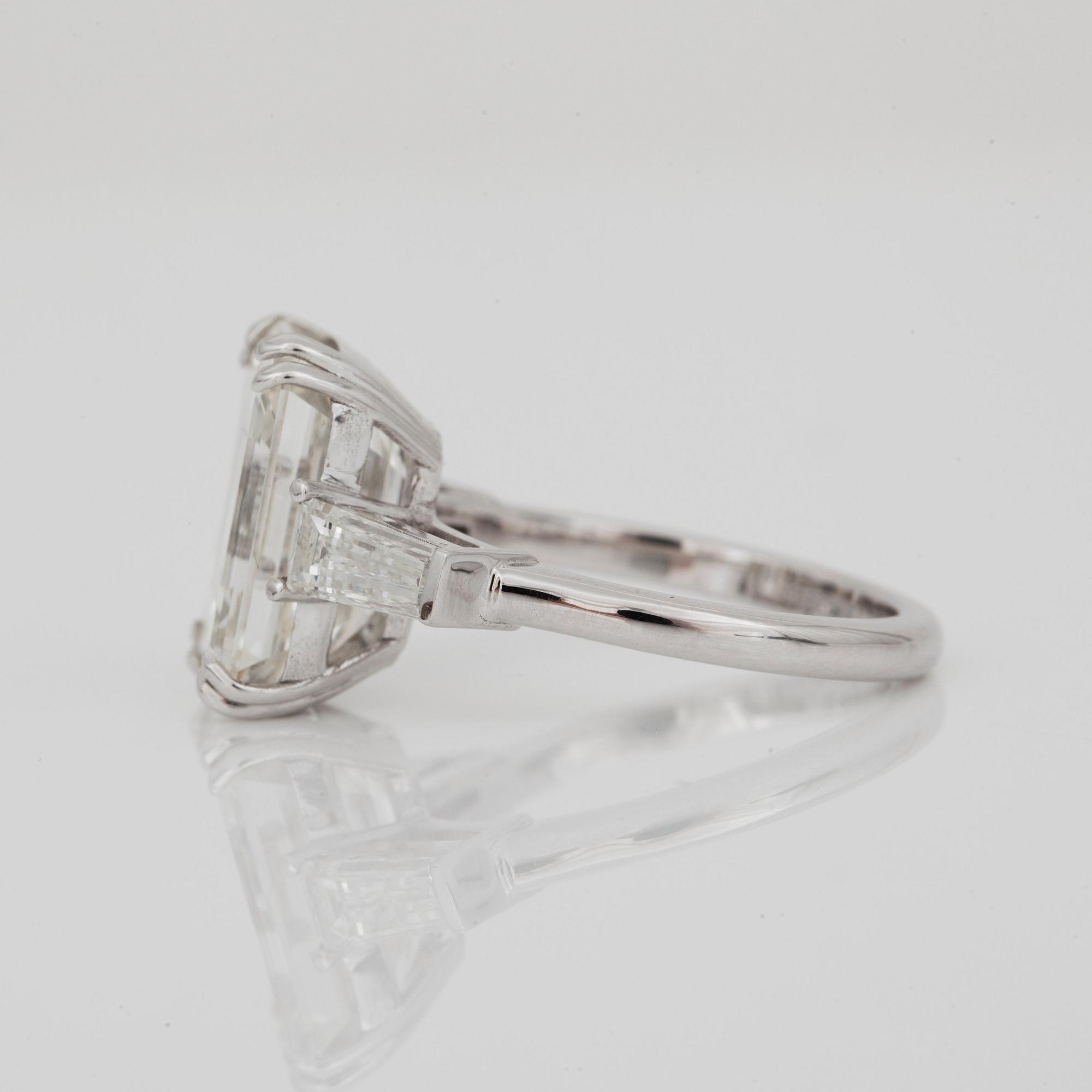 A 7.09 ct I/VS emerald-cut diamond ring. Certificates from HRD and GIA.