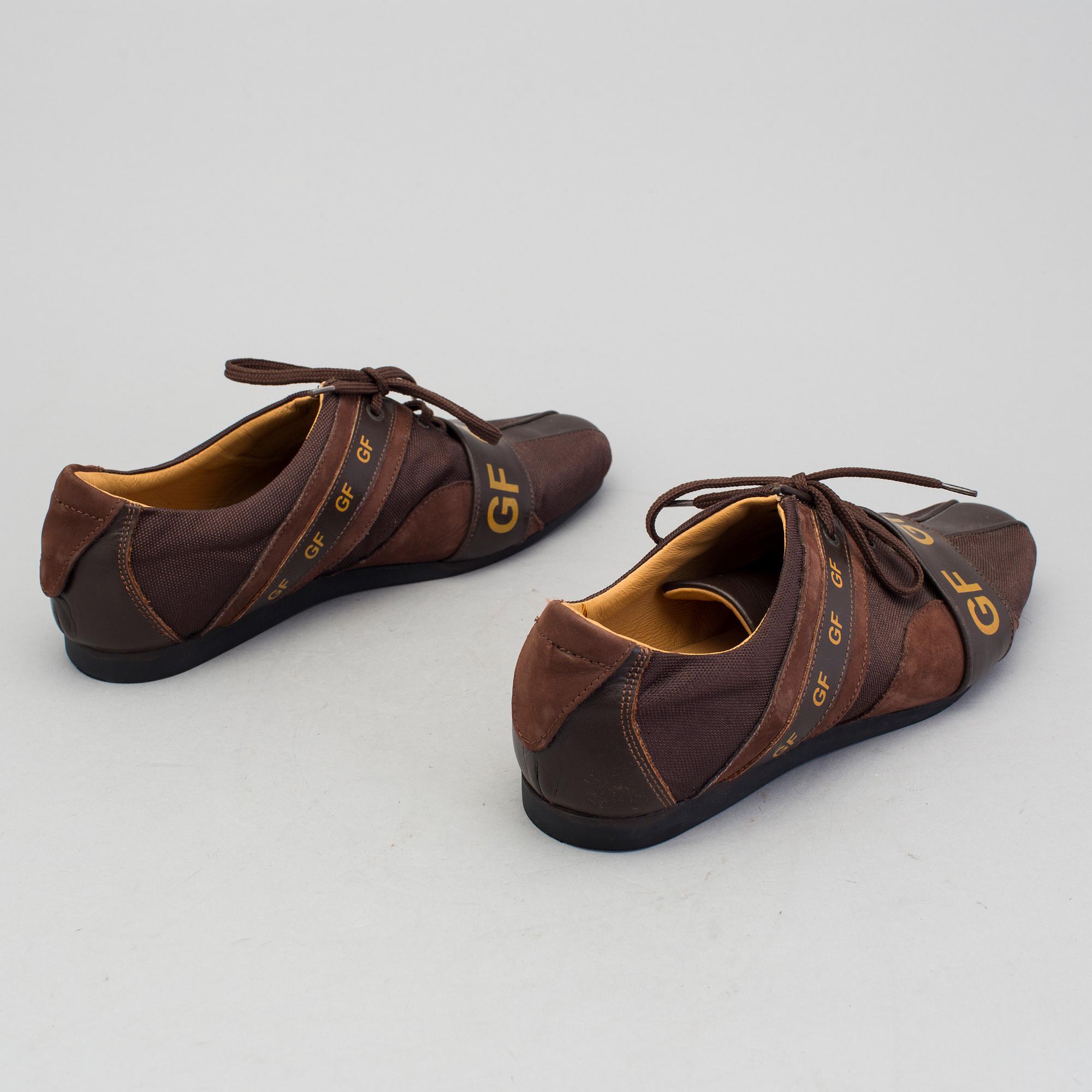 a pair of sneakers by Gianfranco Ferre.