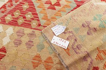 A Kelim carpet, c. 292 x 202 cm.