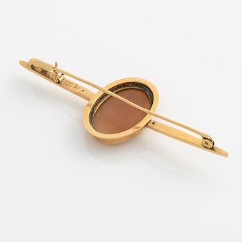 A demi-parure in 18K gold with sea shell cameos.