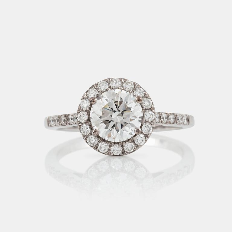 A brilliant-cut diamond ring. Center stone 1.50 cts F/IF according to IGI cert, surrounded by 0.36 ct pavé-set diamonds.