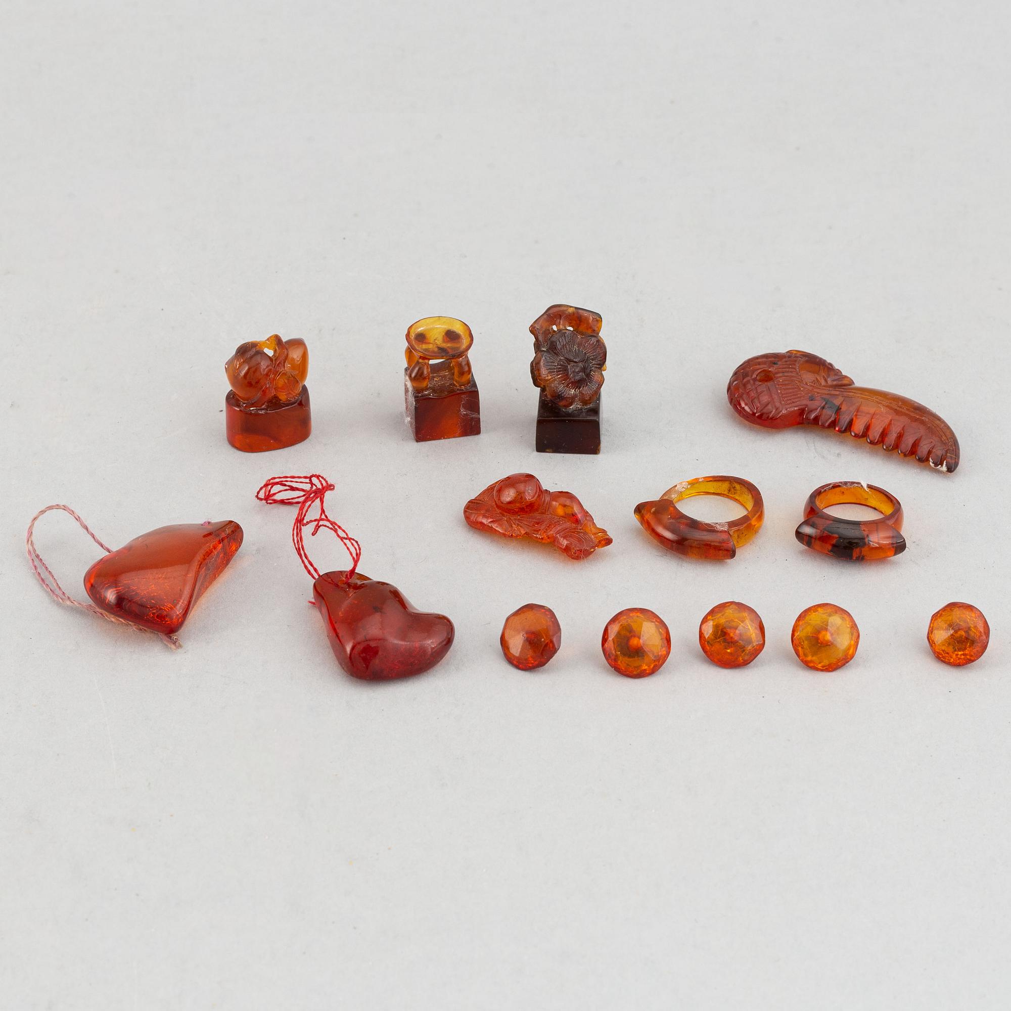 A group of amber objects, China, 20th Century. (14 small pieces).