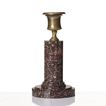 An Empire 'Blyberg' porphyry candlestick from Älvdalen, first part 19th century.