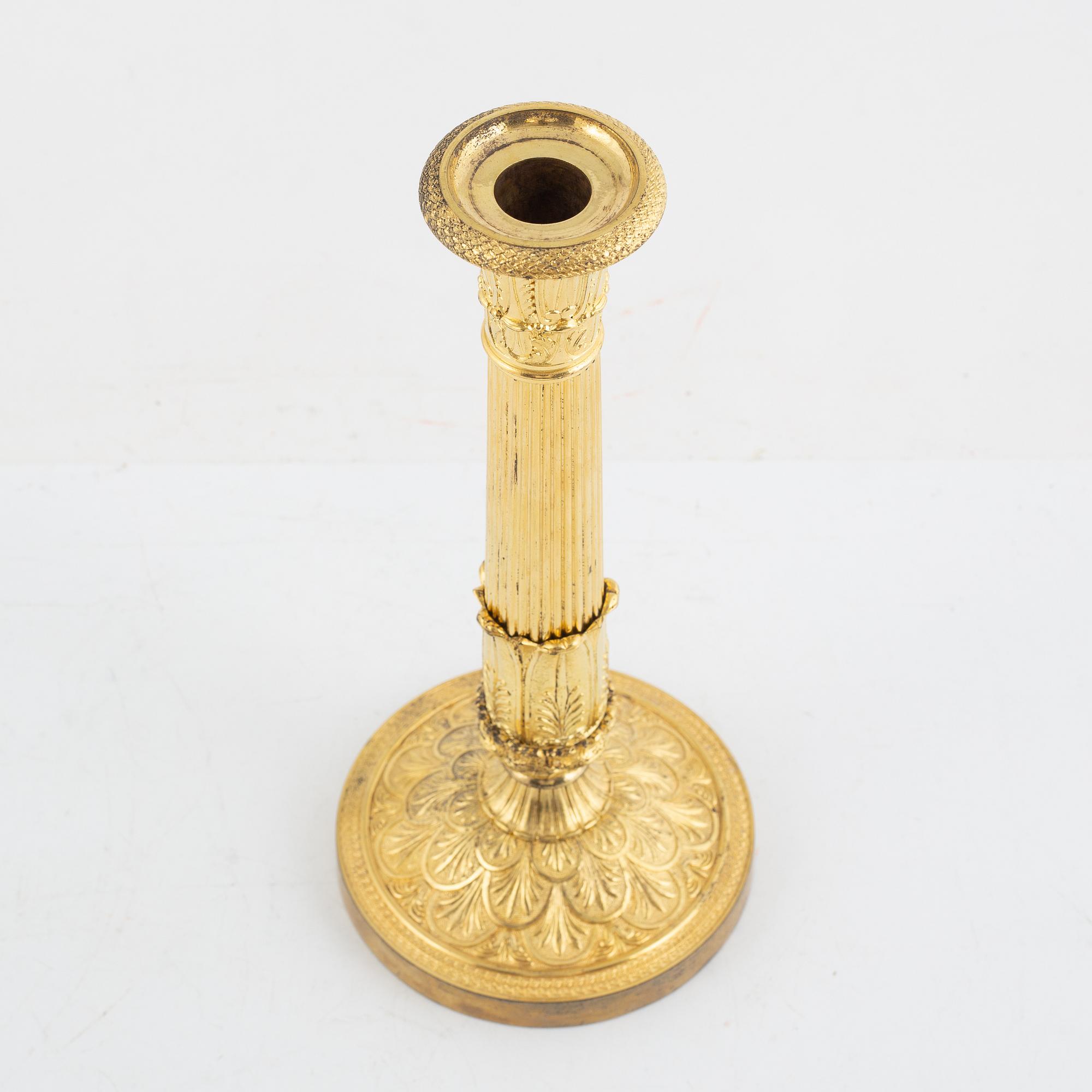 A French Empire gilt-bronze candlestick, early 19th century,