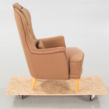 A "Farmor" lounge chair.