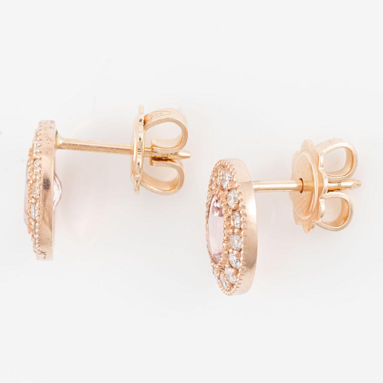 A pair of 14K gold earrings with faceted morganites and round brilliant-cut diamonds.