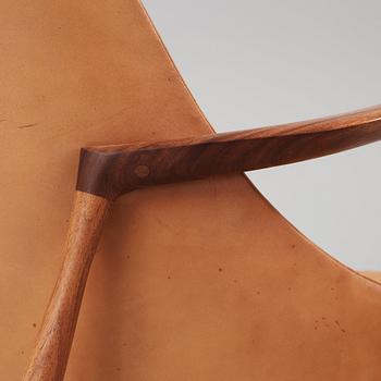 A pair of Ib Kofod Larsen 'Elisabeth' teak and brown leather easy chairs and ottomans, Christensen & Larsen, Denmark.