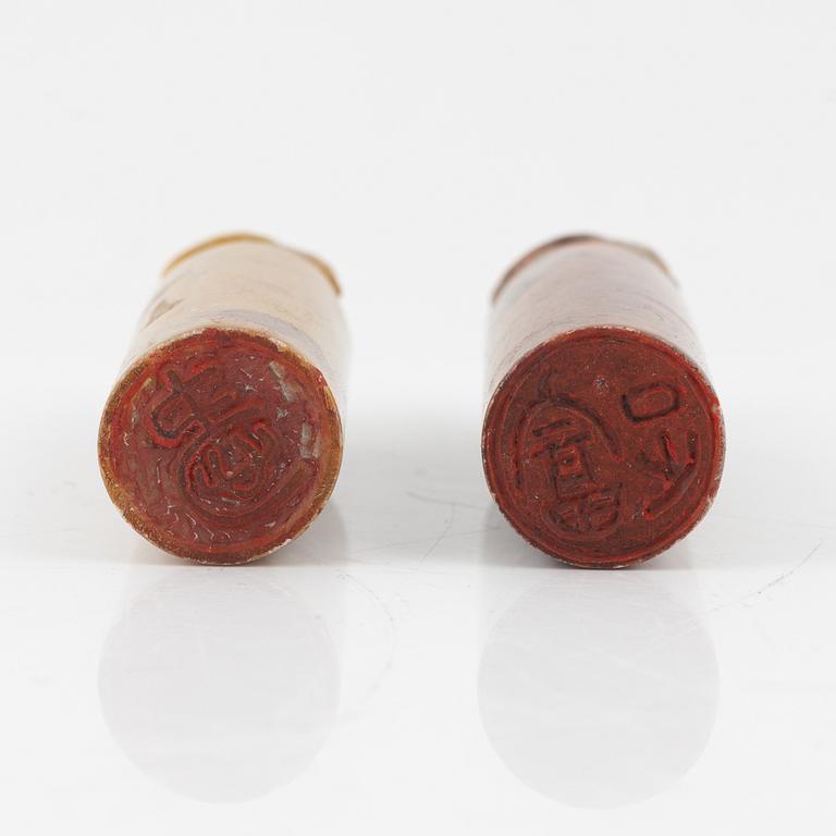 A set of four stone scholars objects and a enameled silver box with cover, Qing dynasty, circa 1900.