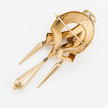 Brosch 18K guld med en pärla.