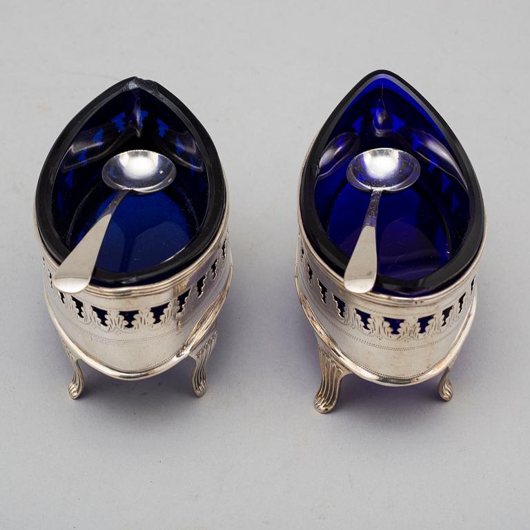 A pair of English 18th century silver and blue glass salts, mark of John Robert probably, London.