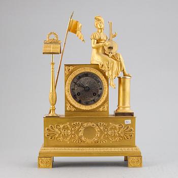 A French Empire gilt bronze mantel clock, early 19th Century.