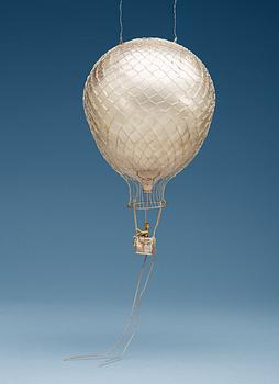 538. An Olle Ohlsson sterling hot-air balloon, with a figure of gold, Stockholm 1985,