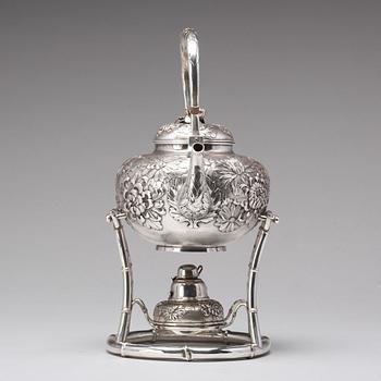 A Japanese silver tea pot with burner and stand, makers mark Samurai Shokai, Yokohama, Sterling.