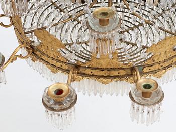 An Empire first half 19th century eighteen-light gilt bronze chandelier.