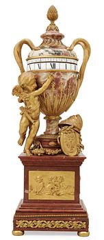 587. A Louis XVI-style late 19th century gilt bronze and marble vase clock "Pendule à cercles tournants", Dufaud Paris.