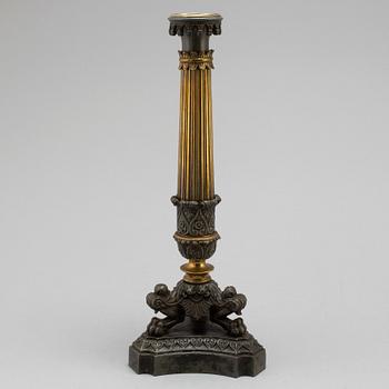A mid 19th century late empire candlestick.
