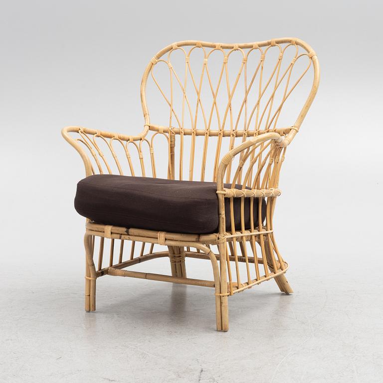 Josef Frank, a model 311 rattan armchair, Firma Svenskt Tenn.