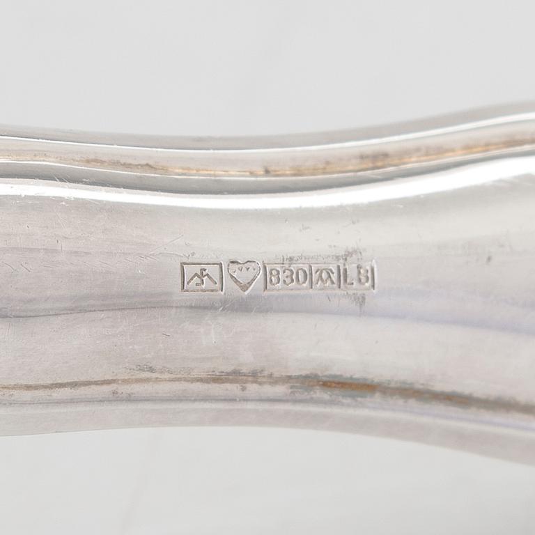 A 78-piece silver 'Chippendale' cutlery set, 1978-2007. Various Finnish manufacturers.