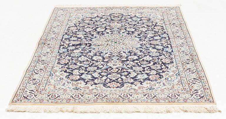 An oriental rug, ca 204 x 126 cm.