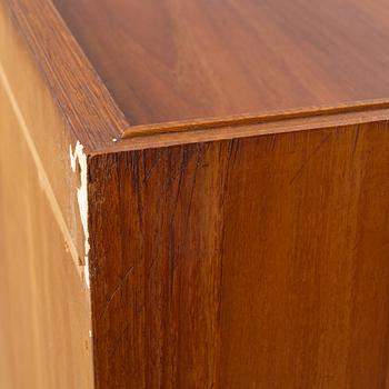 A teak-veneered mid 20th century sideboard.