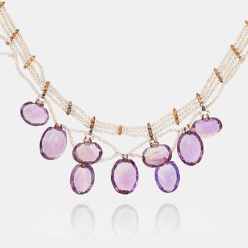 634. An amethyst and probably natural seed pearl necklace.