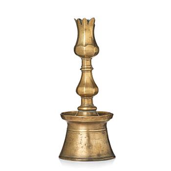 355. An Ottoman brass 'Tulip' Candelstick, Turkey, 17th/18th century.