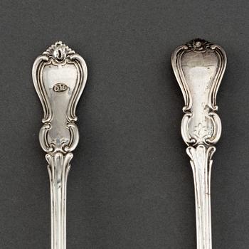 A pair of Swedish 19th century parcel-gilt silver caster-spoons, mark of PF Palmgren, Stockholm 1864.